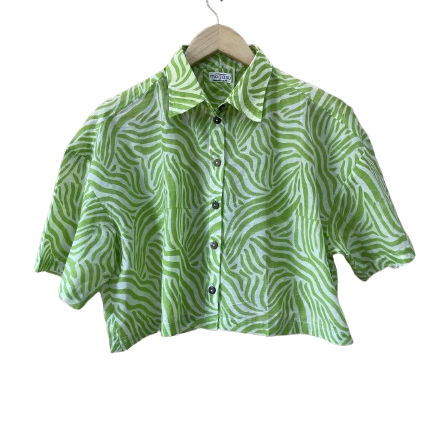 Green patterned Mogasu mul cotton shirt on a hanger against a white background