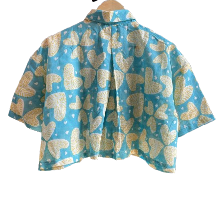Blue Mogasu shirt with gold butterfly pattern on a white background