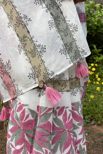 Floral Mogasu mul cotton saree with pink tassels and a patterned design on a white background