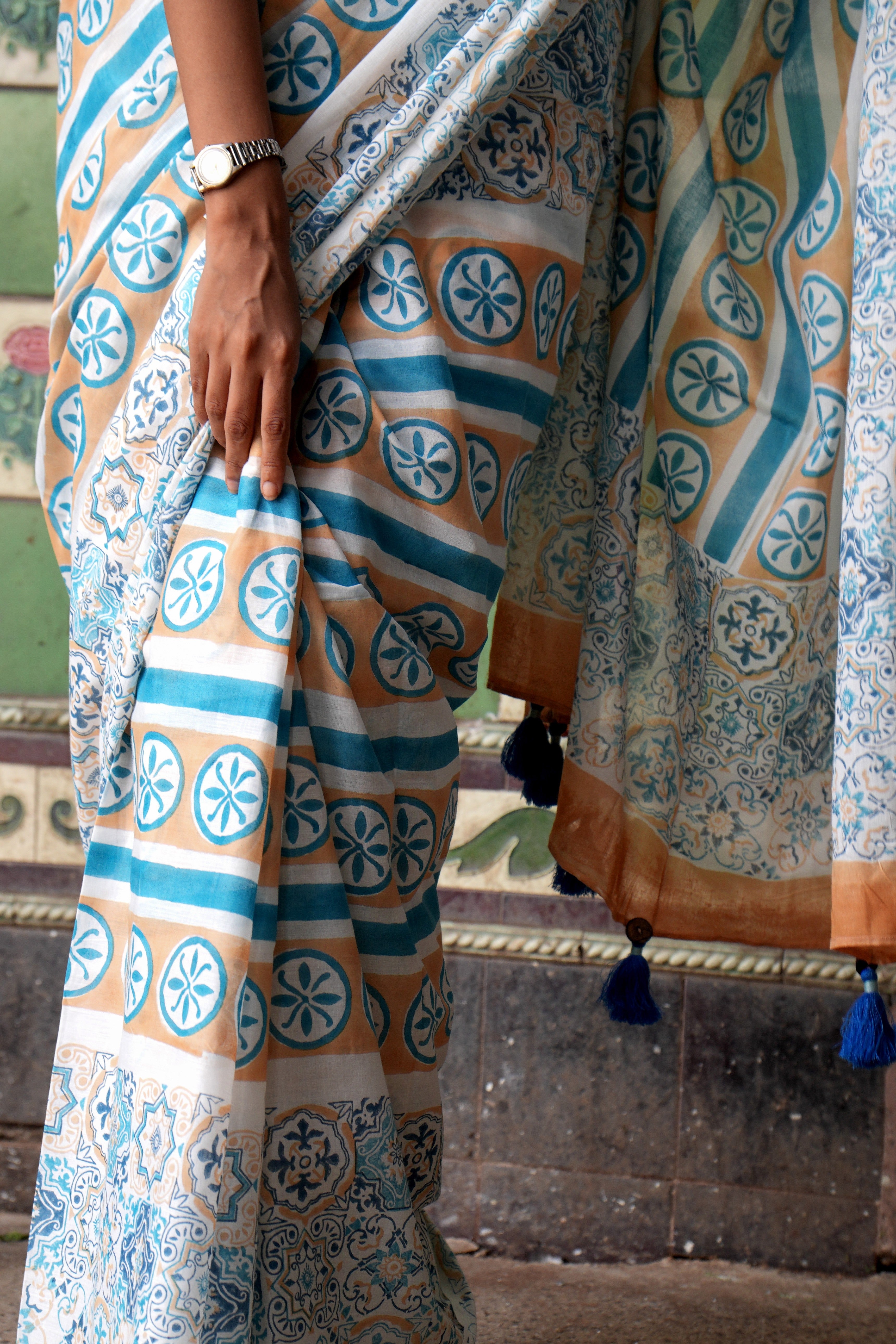Person wearing a Goan Azulejo patterned saree with a blurred background